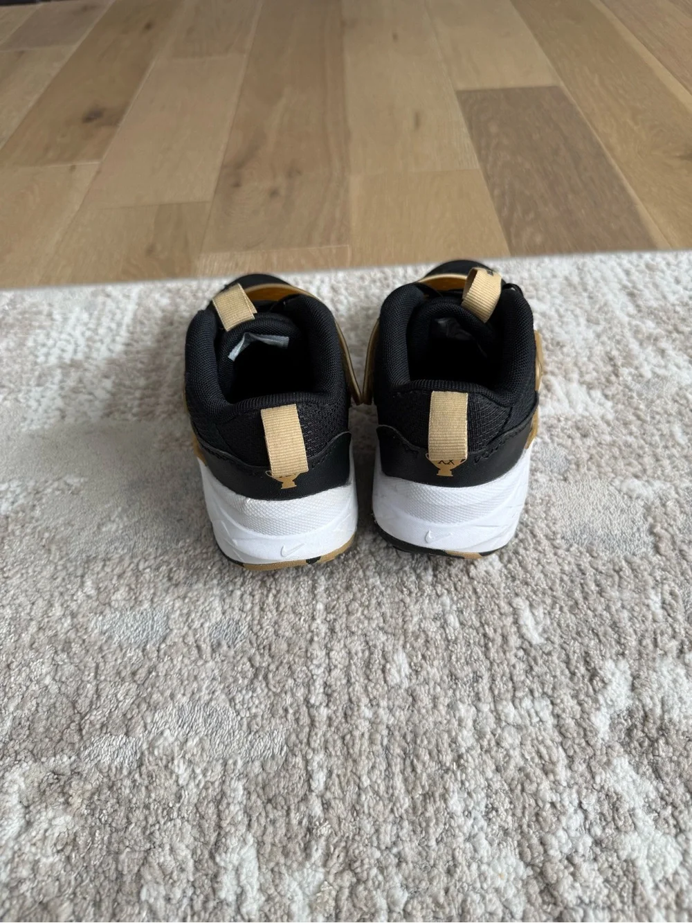 EUC Nike Kids Black and Gold Basketball Shoes